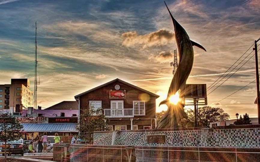 Red Fish Grill on Evans Street at sunset beside the Big Rock marlin fountain, Morehead City NC